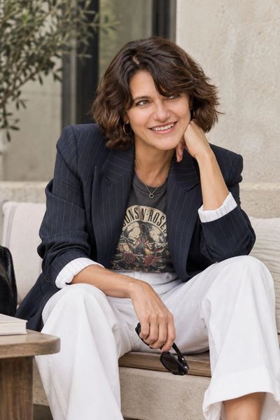 Bernardette M. Orallo smiling, wearing a navy blazer.